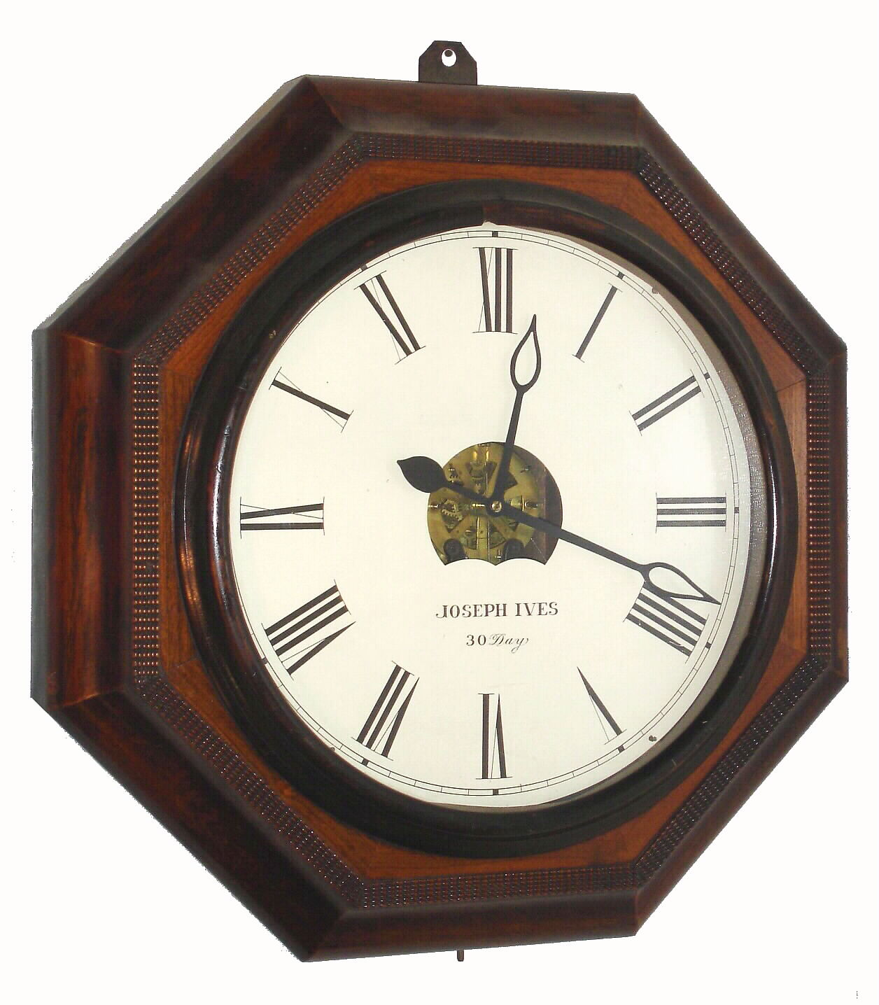 Atkins Clock Co., Bristol, Conn, 30-Day Wagon Spring wall timepiece, a large octagonal case with rosewood veneer and ripple molding accents, and with an old repair label from C R Smith and Son, corner Market and 18th St, Philadelphia, label showing repair on March 6, 1891, and perhaps the original sale in 1862. Circa1860 — Antique Clocks Price Guide