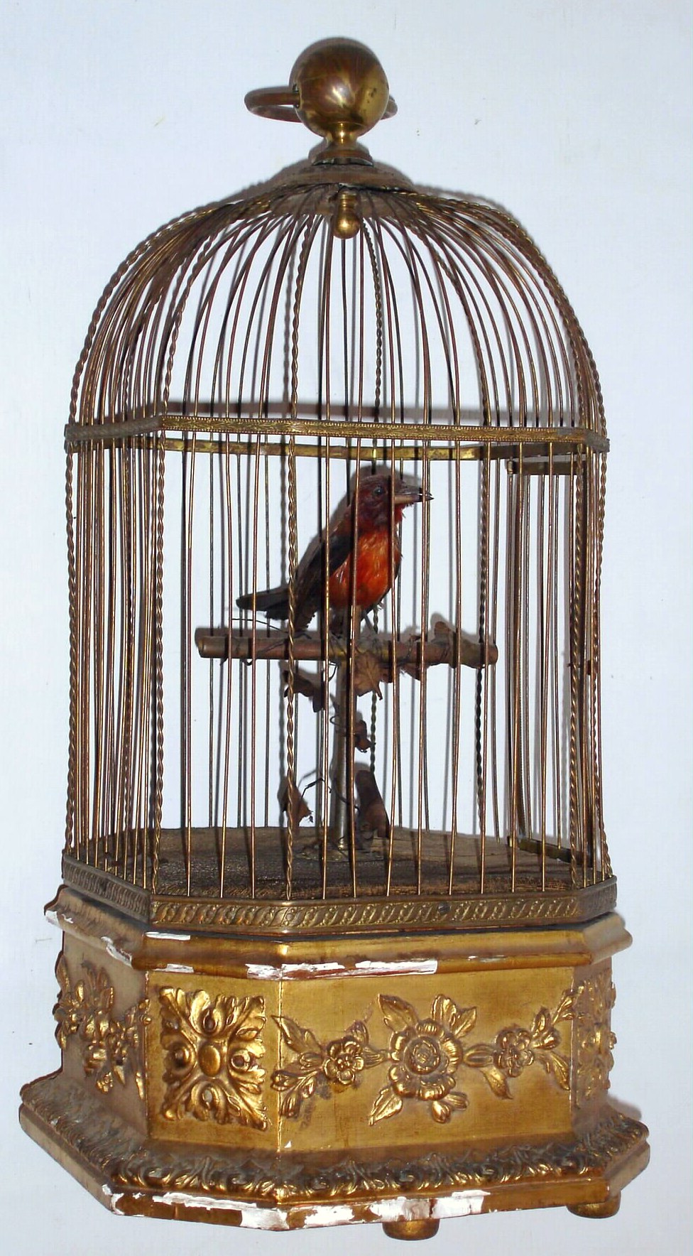 French or Swiss, a large singing bird in cage, with a gilt wood and gesso base, brass cage, controls and winding from the base, C.1880 — Antique Clocks Price Guide