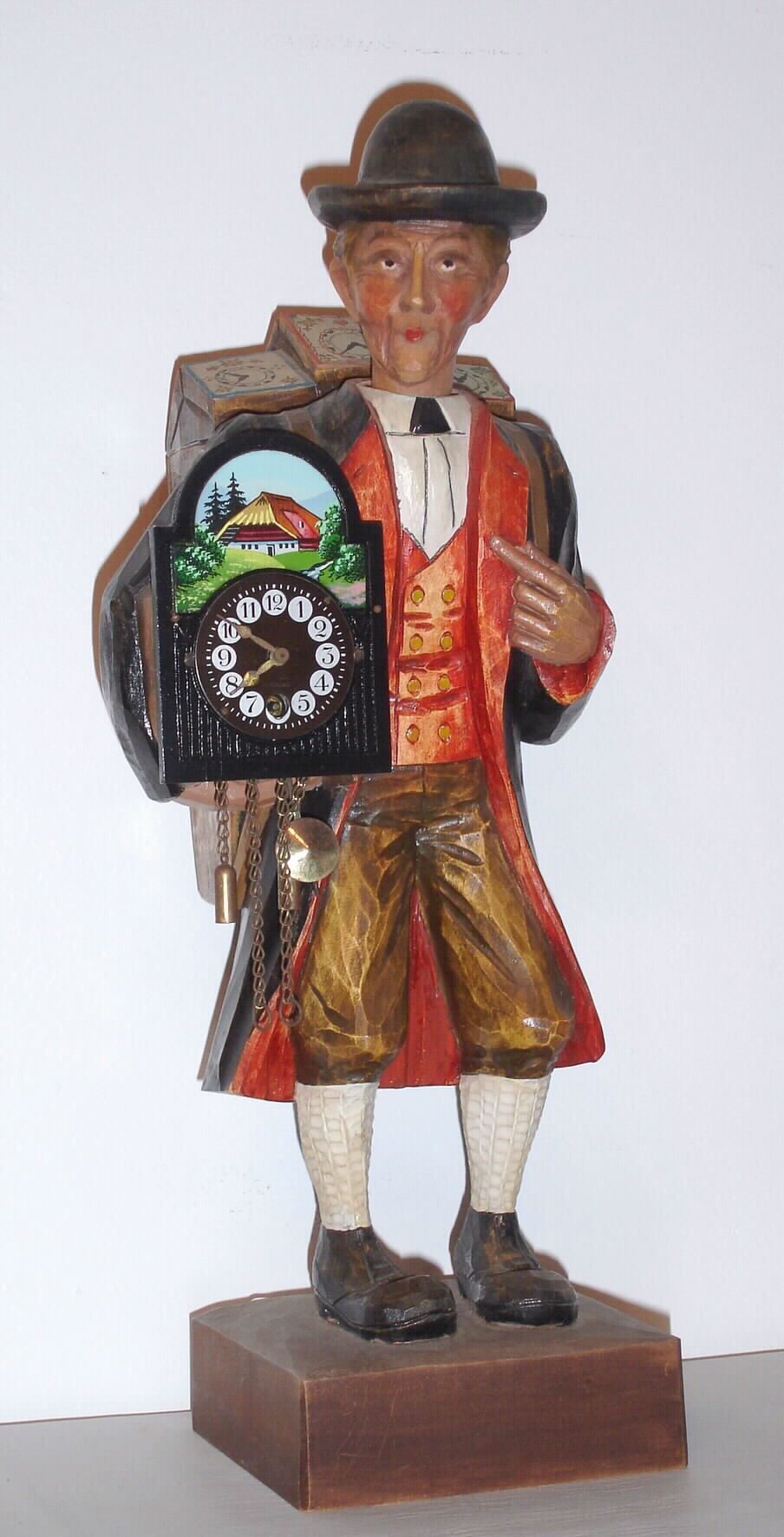 German, Clock peddler / whistler, holding a running clock and whistling a lively tune at will, C.1970 — Antique Clocks Price Guide