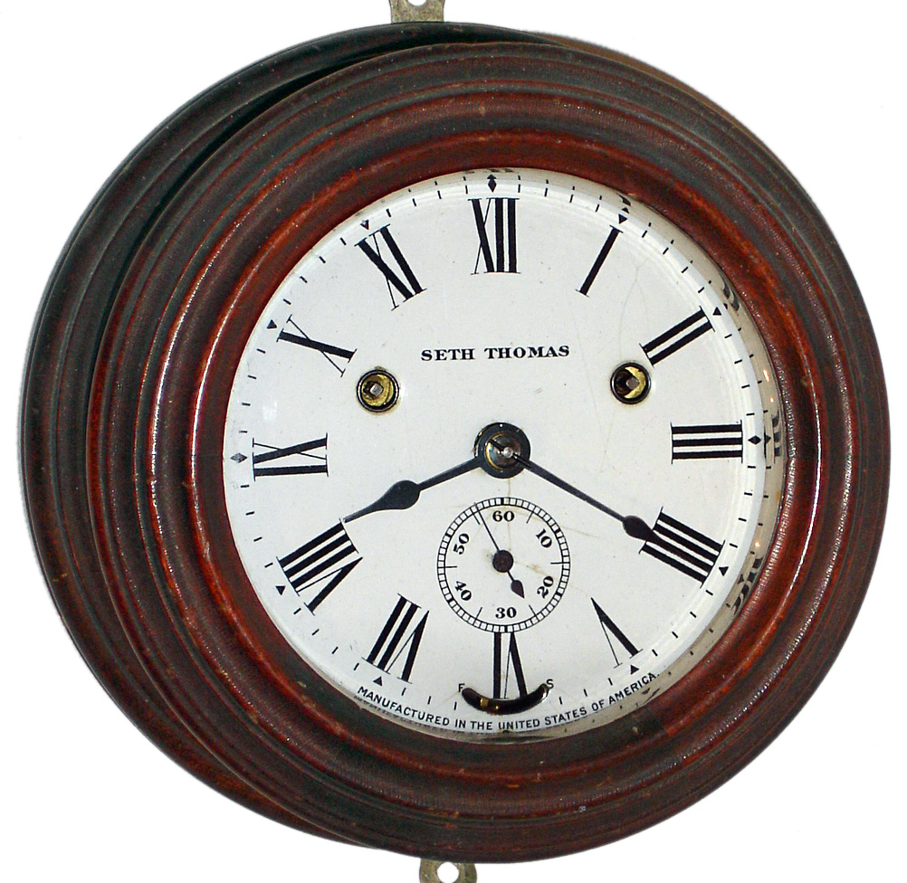 Seth Thomas Clock Co., Thomaston, Conn., "Wardroom" ship's bell clock 30 hour time and strike spring driven hanging clock in mahogany case, c1904 — Antique Clocks Price Guide