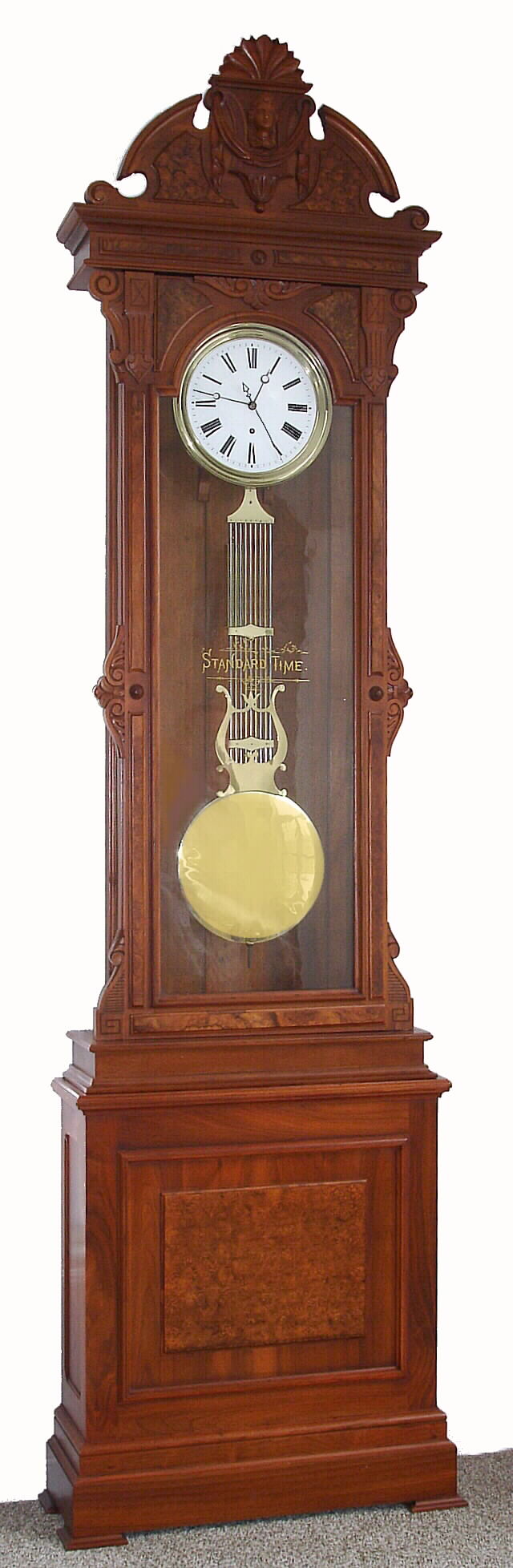 New Haven Clock Co., New Haven, Conn,, standing jeweler's "Regulator No. 4" 8 day time only weight driven movement with lyre / grid iron pendulum in walnut case with burled walnut highlights and white porcelain dial with sweep seconds, c1885 — Antique Clocks Price Guide