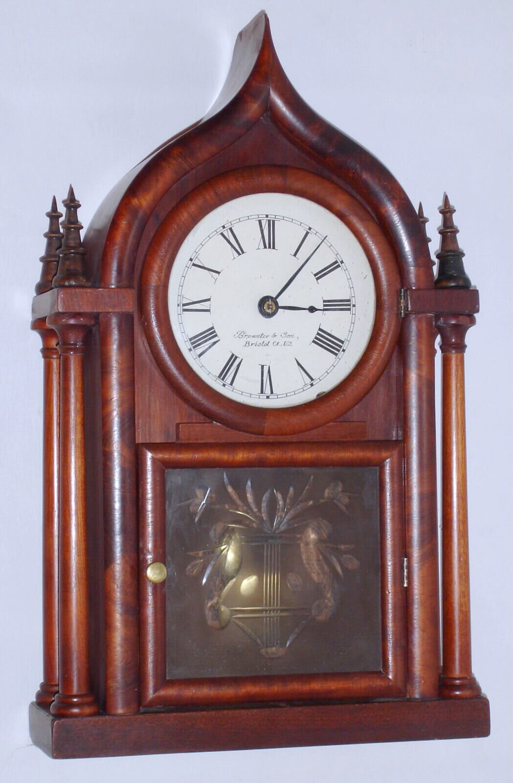 Brewster and Son, Bristol, Conn. "Onion Top" shelf clock with 8 day time and strike spring driven movement in mahogany veneer case, c1855 — Antique Clocks Price Guide