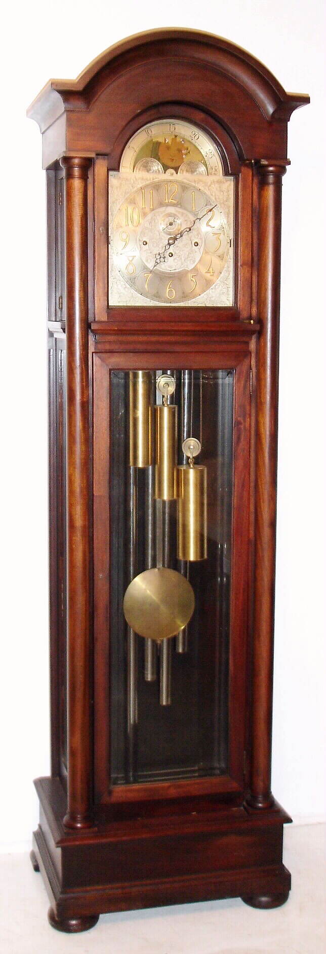 Herschede Clock Co., Cincinnati Ohio tall clock, quarter chiming 5 tube weight driven 8 day movement in a mahogany case with beveled glass front and sides and silvered metal dial with moon phase and strike / silent selection and is signed "ANNA M. MARRS 1924", c1920 sNo. 26414, C.1920 — Antique Clocks Price Guide