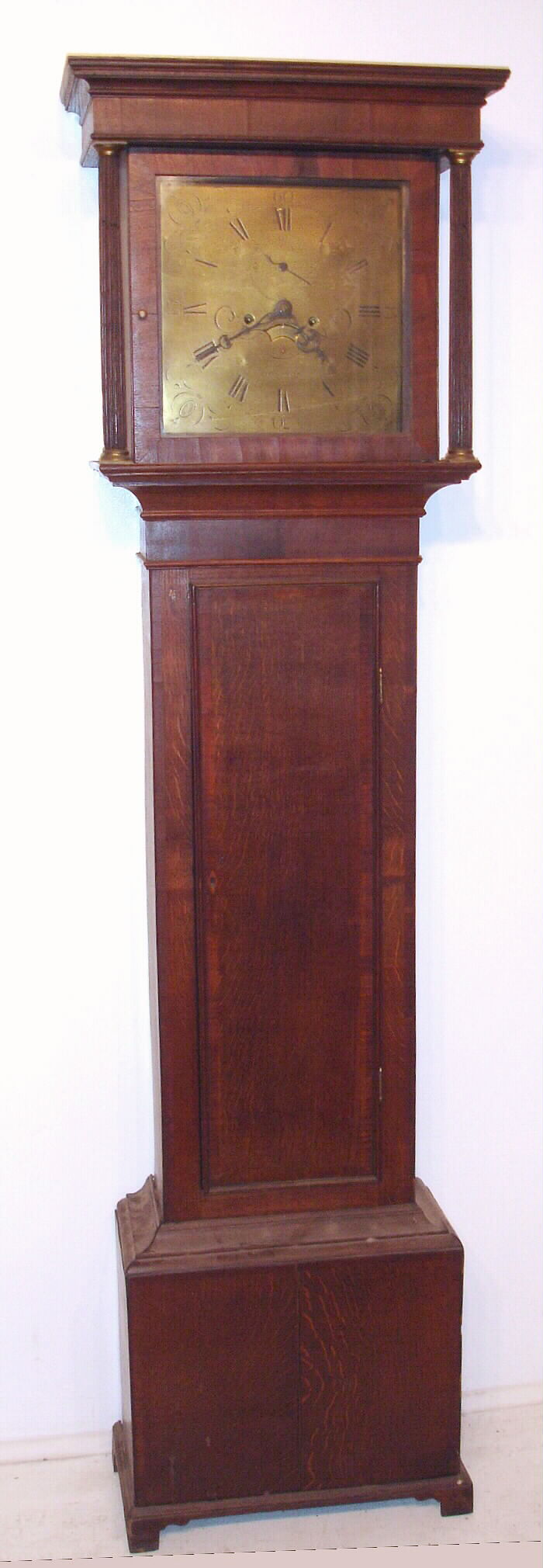 John Murch, Honiton English tall clock 8 day time and strike weight driven movement in flat top oak case with mahogany inlay and brass dial, c1760 — Antique Clocks Price Guide