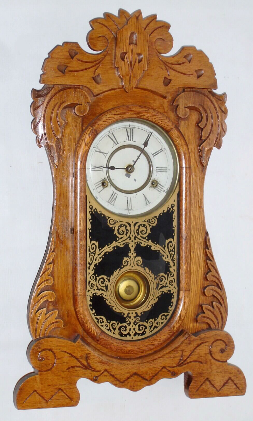 New Haven Clock Co., New Haven, Conn., "General" 8 day time and strike spring driven oak gingerbread clock, c1895 — Antique Clocks Price Guide