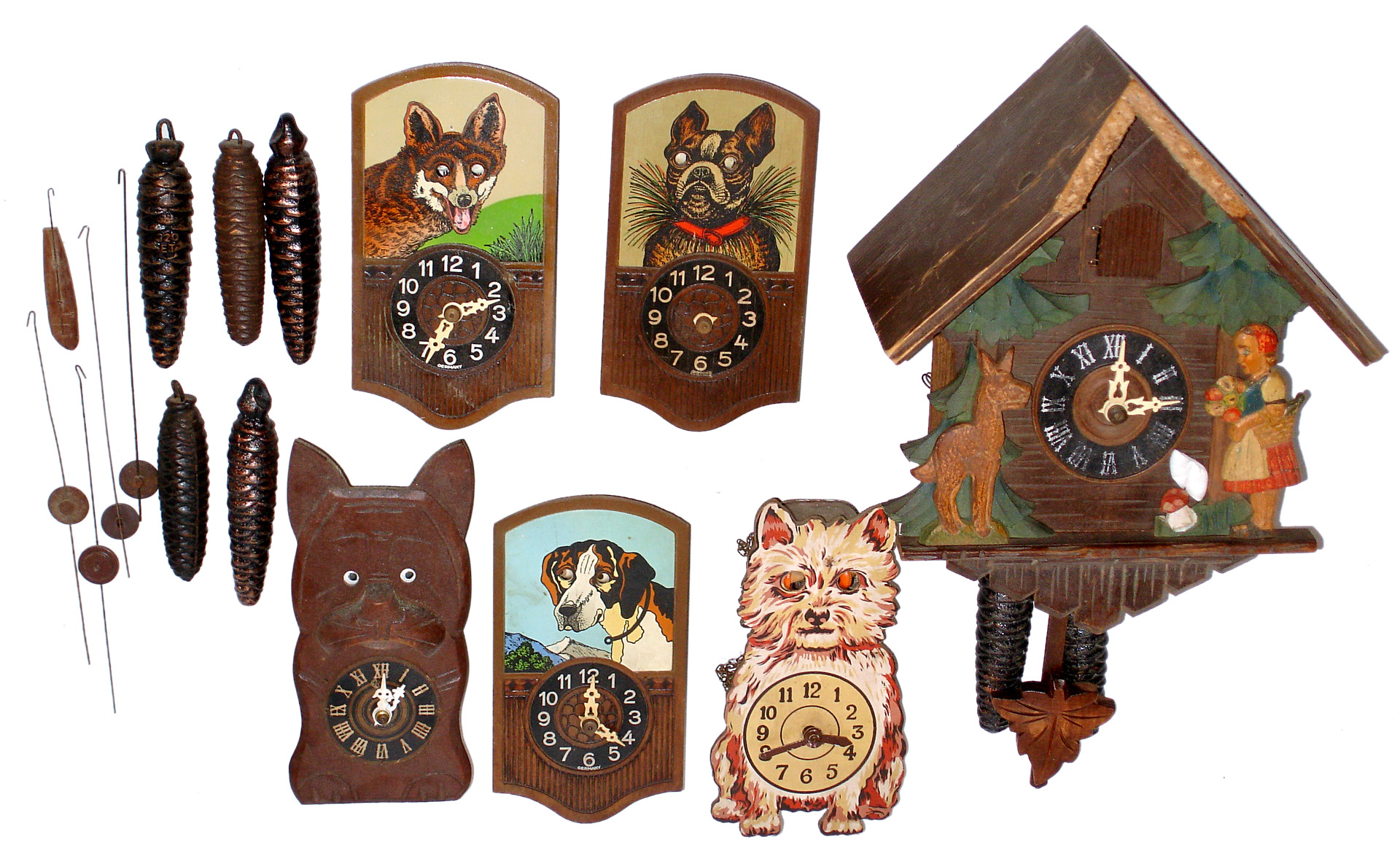 Five German dog related moving eye weight driven novelty clocks, plus one dog related two weight driven cuckoo clock, mid-20th century — Antique Clocks Price Guide
