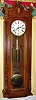 Trend Clock Co., Zeeland, Michigan "Jeweler's Regulator" wall clock with 8 day triple chime weight driven movement with selector for Westminster, St. Michael or Whitington. The case is oak and the dial is enamel, c1980.