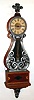 Modern lyre presentation wall clock in impressive full size case. Clock has silvery cast metal front, bezel, bottom, and finial, dial inscription "Virginia P. Timmans, Southwestern Chapter 15, NAWCC 1968", c1968