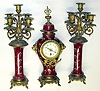 French enameled cast metal 8 day clock and candelabra set, c1900.