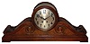 Seth Thomas Clock Co., Thomaston, Conn., manufactured for "Ryrie Bros. Ltd Toronto" oversize "Tambour" mantel clock 15 day time and gong strike spring driven movement in carved oak case with silvered metal dial with raised brass numerals, c1915