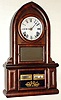 E. N. Welch Mfg Co., Forestville, Conn., "Beehive" type mantel clock with Alfonzo Boardman one year calendar mechanism 8 day time and strike spring driven movement in rosewood veneer case with reverse painted lower tablet and painted metal dial, c1870