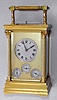 French, Brass Cased Carriage Clock, (signed L.F. Paris), Grand Sonnerie with calendar and alarm in an Anglaise case with Corinthian columns. a lever on the base can select Gde Sonnerie, Silent or Quart's. Makers trademark is a shaped shield with the letters LF, and the city "Paris" showing above, serial No. 3231. We could not find this exact trademark, c1900