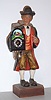 German, Clock peddler / whistler, holding a running clock and whistling a lively tune at will, C.1970