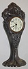 Waterbury Clock Co., 30 hour cast metal case novelty timepiece. Plated silver case made by the Benedict Mfg. Co. of East Syracuse, NY, who were in business from 1894 to 1953. The movements supplied by Waterbury, c1914. This timepiece was manufactured by Waterbury as part of their business of manufacturing sterling and silver-plate items.