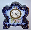Ansonia Clock Co., "Chickadee", 30-hour miniature porcelain mantel timepiece. c.1904