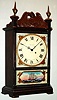 Waltham Watch Co., Waltham, Mass., miniature mantel clock 8 day spring driven movement with lever escapement in mahogany case with eagle splat and reverse painted tablet, c1930