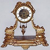 French cast metal mantel clock with swinging cupid for pendulum and 8 day time and strike spring driven movement, c1890