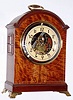 Eureka Clock Co., Ltd., London, No. 5559 early electric tiger striped walnut bracket clock, c1907.