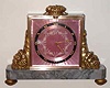 Gubelin, Lucerne, Switzerland, ormolu and marble time and strike desk clock, jeweled lever escapement, rear wind, striking on internal coiled wire gong with pink guilloche enamel Roman numeral dial, c1920