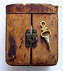 French travel clock in faux tortoise shell case with key wind key set pocket watch movement and Roman numeral white enamel dial, c1900 including original outer leather travel case