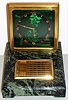 E. Gubelin, Lucerne, Switzerland Art Deco desk clock 8 day spring driven movement in gilt frame with green guilloche enamel dial with Roman numeral black chapter ring on black and green marble base with separate manually operated calendar, c1920