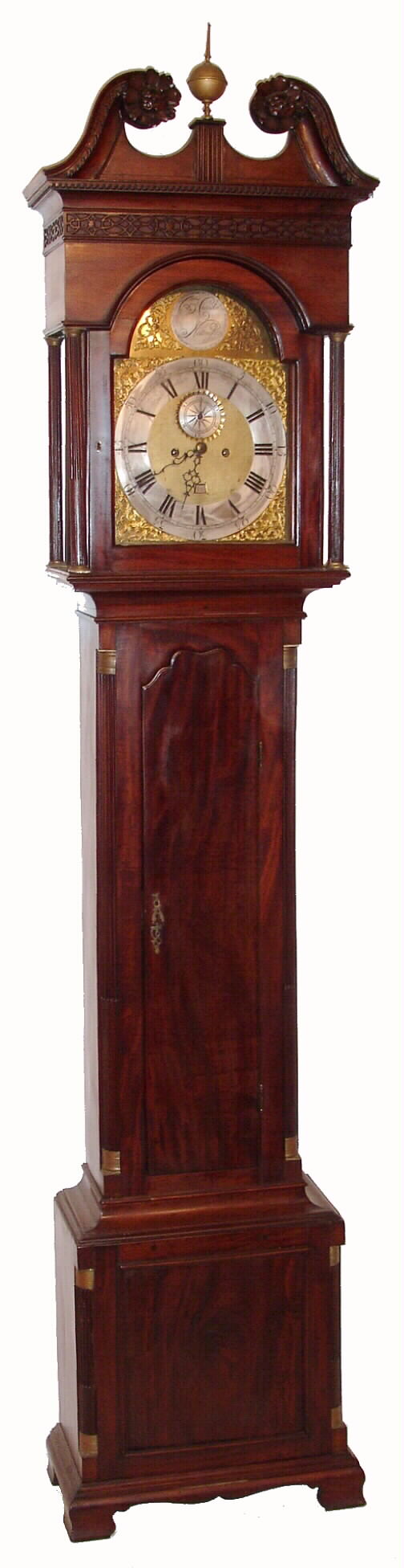 Benjamin Chandlee, Nottingham, (PA), a Chester County brass dial, bell strike, 8 day, weight driven movement, c1770 associated with a central Delaware mahogany case with scalloped top door, reeded side columns with simple brass capitals, a broken arch hood and deeply carved rosettes, c1795 — Antique Clocks Price Guide