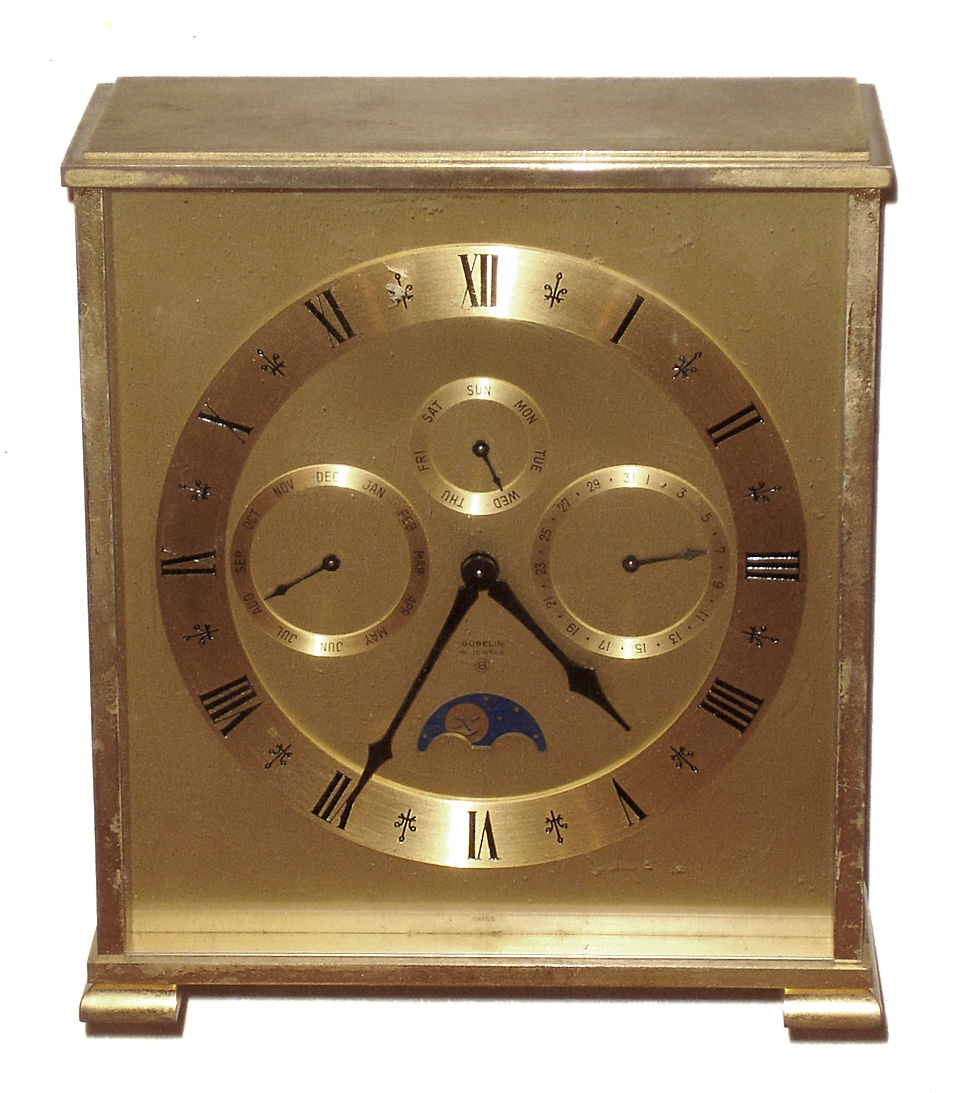 Gubelin, Switzerland multi-dial calendar moon phase desk clock, 8 day 15 jewel alarm movement in brass case, c1965 — Antique Clocks Price Guide