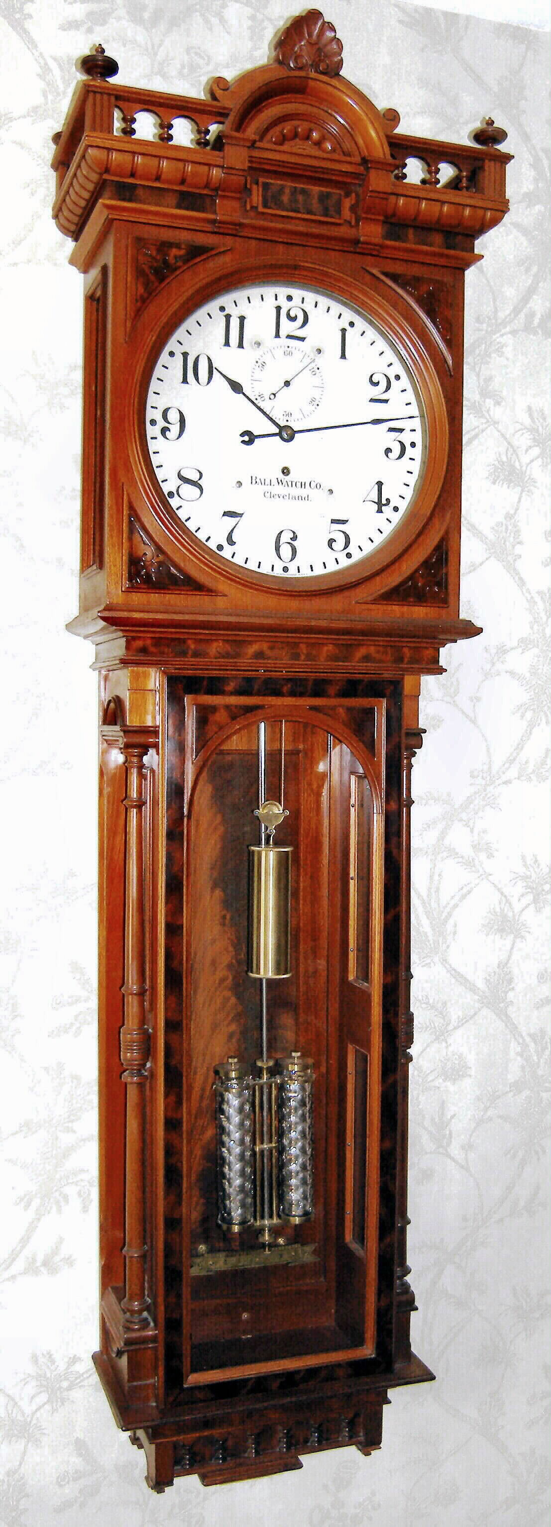 Seth Thomas for Ball Watch Co., Cleveland, "CUSTOM" model jeweler's regulator, weight driven, unlisted in Seth Thomas catalogs, however there are 4 known examples, each slightly different. See Tran Ly's book on Seth Thomas, 3rd Edition, pages 316 and 317 for detailed photos and information. This model with No. 68 movement with jeweled pallets. From the Bob Wasserman collection. Walnut case with burled accents. c1890 — Antique Clocks Price Guide