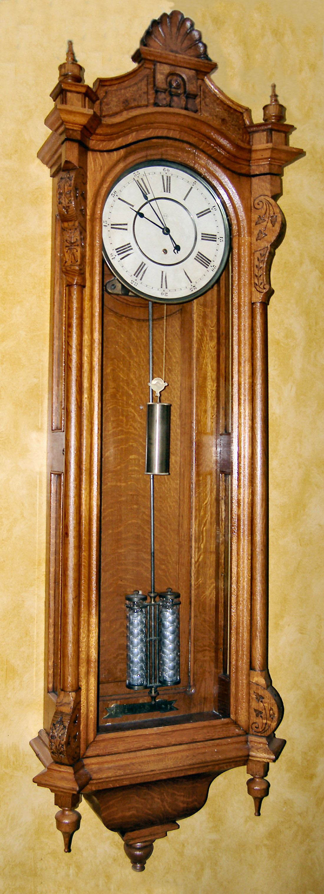 Seth Thomas Clock Co., Thomaston, Conn., "REGULATOR No. 19" station regulator in oak and with 2 jar mercury pendulum (thumb print jars), weight driven, 8 day. From the Bob Wasserman collection, c1890 — Antique Clocks Price Guide