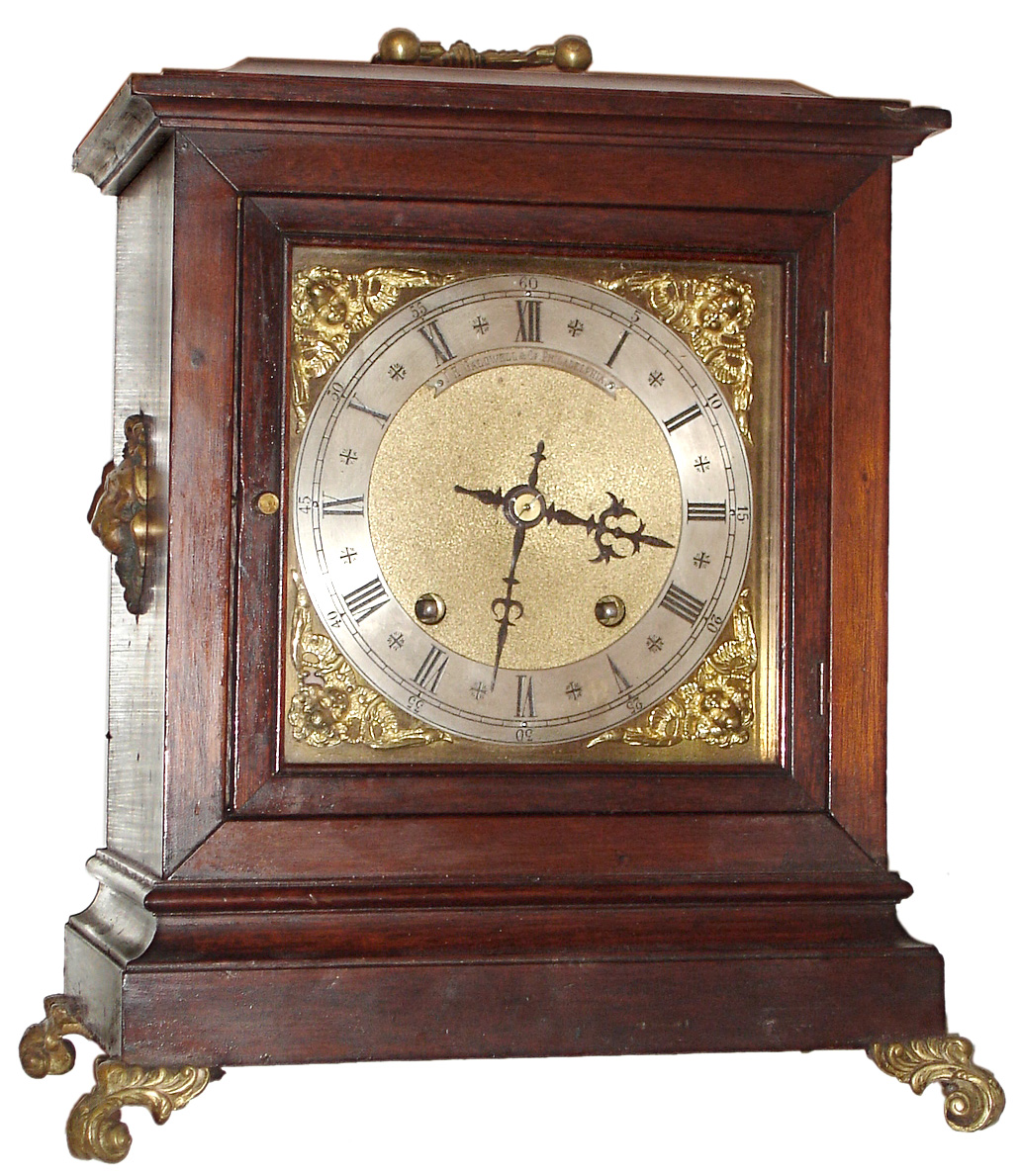 Winterhalder and Hofmeier, Germany for J.E. Caldwell, Philadelphia bracket clock, 8 day, time and quarter hour bim bam strike in a mahogany case with brass handles, feet and lion ornaments, c1900 — Antique Clocks Price Guide