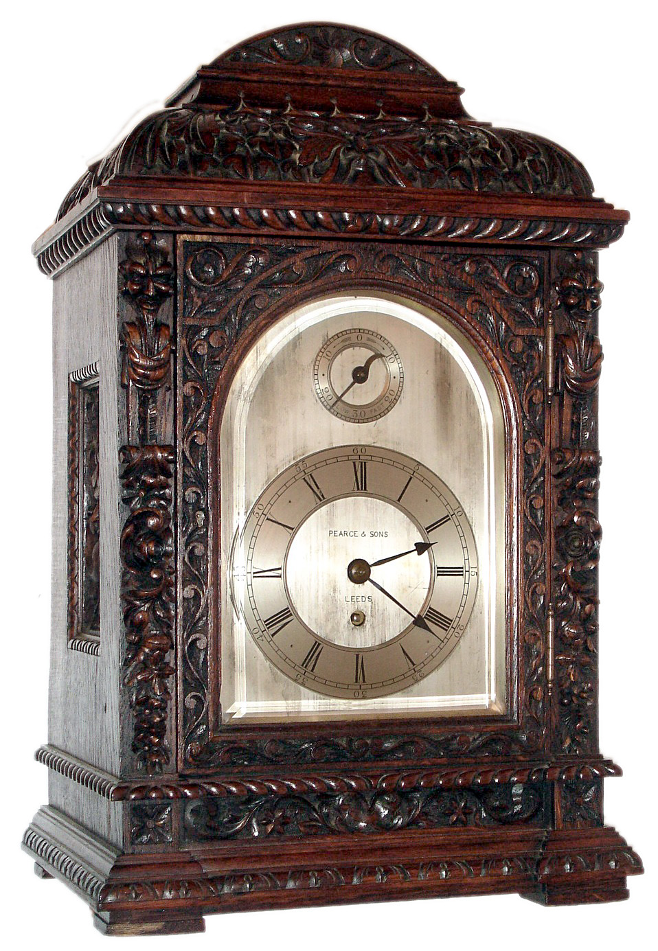 Winterhalder and Hofmeier, Schwarzenbach, Germany for Pearce and Sons, Leeds bracket clock 8 day, time only, single fusee movement in a heavily and intricately carved oak case with silvered dial and applied chapter ring and slow / fast regulator disc, c1900 — Antique Clocks Price Guide
