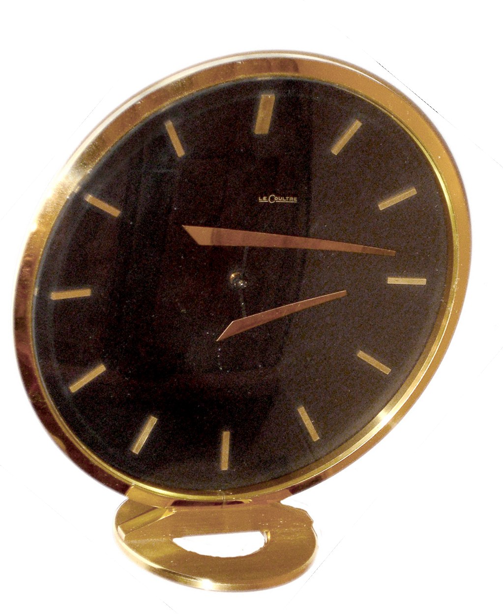 LeCoultre, Switzerland "Floating Hands" desk clock, ref. 425, 8 day, spring driven, Swiss movement in gilt brass and glass circular case with raised baton hands and hour markers with unusual "floating hand" illusion while telling time, c1960 — Antique Clocks Price Guide