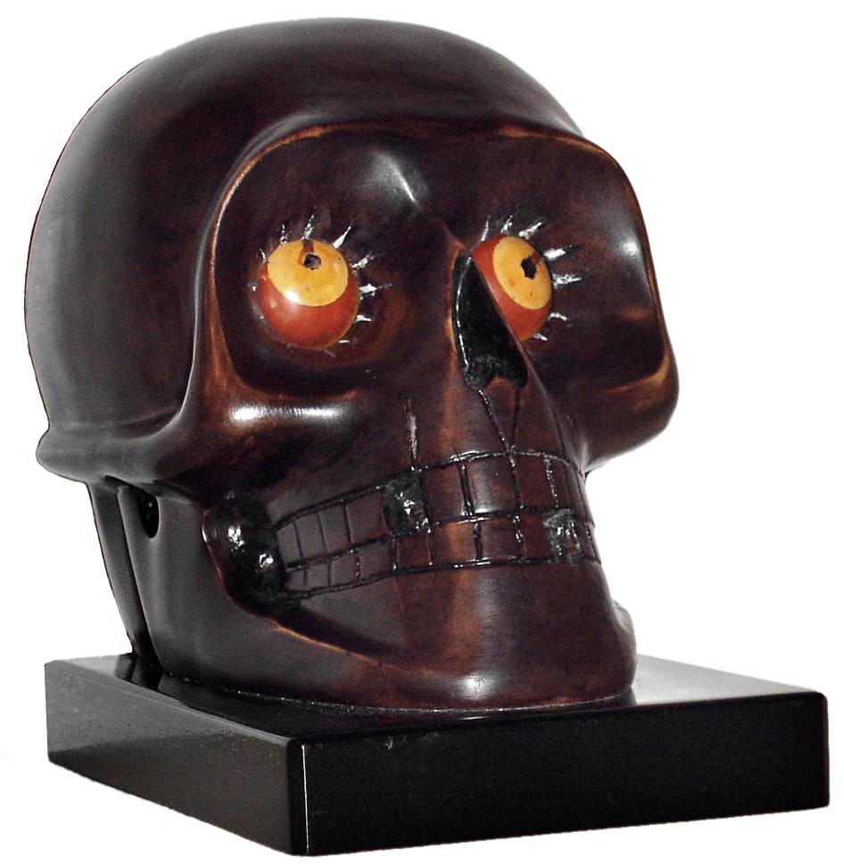 Oswald Uhrenfabrik, Germany, "Skull" rotating eye time piece, 30 hour, time only spring driven movement in a composition case with red and yellow eyes and black pupils, c1930 — Antique Clocks Price Guide