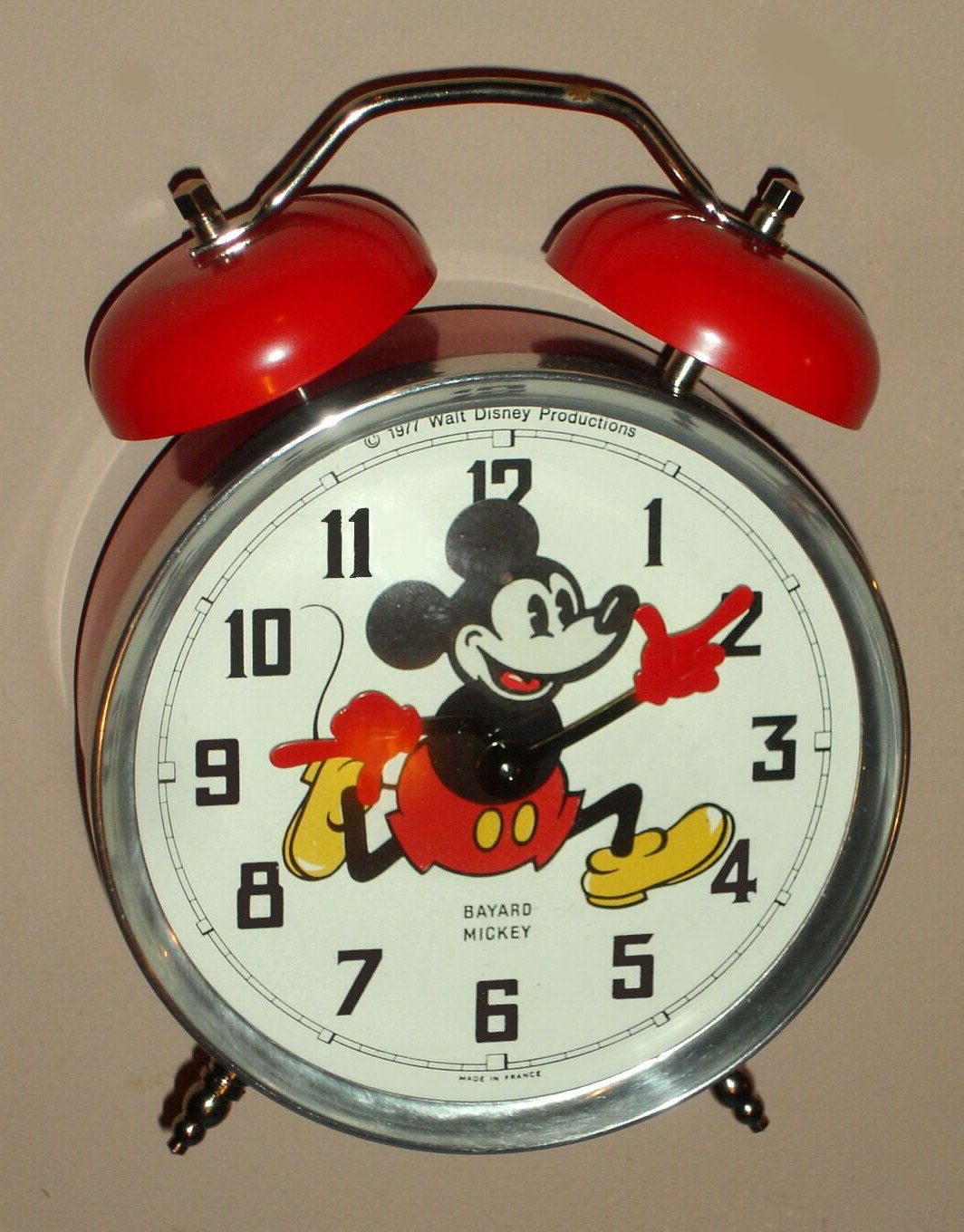 Mickey Mouse mechanical alarm clock automaton with Mickey's hands indicating the hours and minutes and his head ticking, licensed by Walt Disney Productions copyright 1977, made in France and new old stock, c1977 — Antique Clocks Price Guide