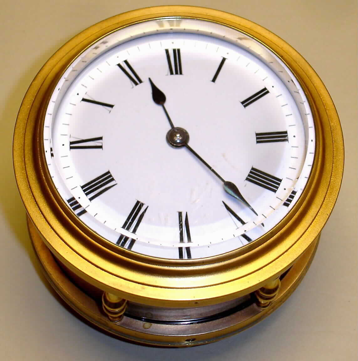 French, rare Round cased fusee carriage clock with dial facing upwards , 8 day, time only, spring driven movement with 2 plane lever escapement in brass case with four brass feet, and a cylinder of glass surrounding the movement, allowing the whole movement to be visible, c1886 — Antique Clocks Price Guide