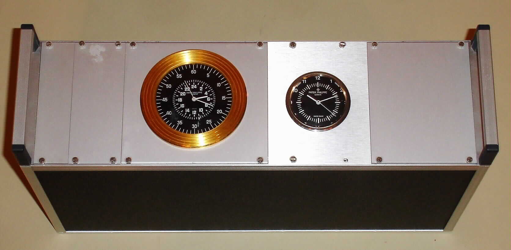Patek Philippe, Geneve, integrated Electronic Master Clock System in two module tower with quartz movements and black dials, c1975 — Antique Clocks Price Guide