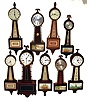 Clocks- 9 (Nine) Banjos: American wood case examples by Seth Thomas, Herschede, New Haven, Sessions. Two are plug-in electrics, others are windup.
