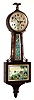 E. Ingraham, Bristol, Conn. "Treasure" banjo clock, 8 day time and duplex [ding-dong] strike spring driven pendulum movement in solid hardwood case, with mahogany finish, c1934.