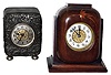 Clocks- 2 (Two) small rear wind 30 hour metal drum clocks in ornate stands, Ansonia and British United, late 19th century
