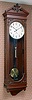 Seth Thomas Clock Co., Thomaston, Conn., "REGULATOR No. 63", large walnut hanging wall clock, weight driven, 8 day in an attractive case with dentil molding along cornice and a pediment top with finely carved trim. From the Bob Wasserman collection, c1887.