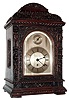 Winterhalder and Hofmeier, Schwarzenbach, Germany for Pearce and Sons, Leeds bracket clock 8 day, time only, single fusee movement in a heavily and intricately carved oak case with silvered dial and applied chapter ring and slow / fast regulator disc, c1900