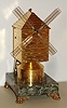French Industrial "Windmill" only driven by a spring clock work mechanism housed in a gilded brass case on a marble base with four paw feet, c1890