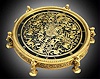 E.F. Caldwell, N.Y. table clock with Greco-Roman Classical theme. The E. Howard and Co., Boston, 8 day, time only, spring driven, nickel damascene movement has a lever escapement and micrometric regulator, s#2531, and is housed in a large gilt and patinated bronze circular case with six legs in the form of winged satyrs raising the case about 1 1/4" off the ground. The back plate is engraved in script "E.F. Caldwell and Co. Inc. New York". The dial facing upwards is highly ornate with Classical decor including finely cut and engraved mythological figures and animals, c1915