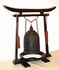 A rare and early Japanese bell clock (Tsurigane Dokei) within a finely cast bronze bell with Japanese characters and double headed dragon form handle; having a posted, iron, double spring driven, striking movement with crown wheel escapement and time regulated by a large circular balance with moveable double weights, originally for adjusting the temporal hours every day before each sunrise and sunset with the change of each Japanese season. The brass dial with single, fixed hand has traditional Japanese numerals 9 through 4 with applied silvered butterflies to the original surrounding dial plate. The rotating dial with adjustable "hour" and "half hour" markers is a common 19th Century upgrade to many very early Japanese clocks that have a single foliot or balance, since changing the weights and hence the rate before sunrise and sunset each day was extremely unhandy. This is verified by J. Drummond Robertson in The Evolution of Clockwork , page 226 saying "we find some of the old clocks "converted" to the new style of motion work. The old fixed hour circle with its revolving centre was removed and the new revolving circle and its fixed hand with adjustable "hour" plates was substituted." This is the case in each of the only other examples of Japanese Bell Clocks of which we are aware: see Japanese Clocks by N.H.N. Mody, plate 113, fig.1 for an almost identical example to the clock being offered. This dial conversion is also apparent in the Bronze Bell Clock sold at Sotheby's Masterpieces From the Time Museum Sale, Part Two, 19 June 2002, lot 126. An inscription on the bell reads Fukushima ya Katsutaro 1689, who may be the maker of either the clock or the bell. Most Japanese spring driven clocks have a fusee to the time train and a going barrel to the strike train. This movement is anomalous, in that is has two going barrels. It may be that the Japanese had not developed a method of turning a fusee at this early date, C.1690