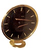 LeCoultre, Switzerland "Floating Hands" desk clock, ref. 425, 8 day, spring driven, Swiss movement in gilt brass and glass circular case with raised baton hands and hour markers with unusual "floating hand" illusion while telling time, c1960