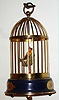 German singing bird in painted brass cage, c1960