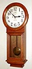 New Haven Clock Co., New Haven, Conn., "Saturn" wall clock, 30 day, time only, double spring driven movement in oak case with painted metal dial, c1911