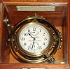 Hamilton Watch Co. Model 22 deck watch with 48 hour wind indicator 35S 21J, stem wind, pin and pendant set, Adj to Temp and 6 pos, parallel line damascene nickel movement with lever escapement and micrometric regulator. The Arabic numeral silvered metal dial has blacked steel hands. The movement is housed on gimbals in mahogany box with "HAMILTON WATCH CO LANCASTER, PA., U.S.A." tag, s#2F2008