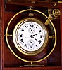 Elgin Watch Co. Father Time deck watch grade 367 with wind indicator 16S 21J, stem wind, lever set, damascene nickel movement with free sprung lever escapement and 2 1/4" Roman numeral porcelain single sunk dial, s#21869703 in gimbaled mahogany box