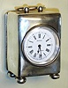 French for retailer Byrne, Liverpool, England miniature carriage clock, 8day, time only, spring driven movement with platform escapement in sterling silver case with Roman numeral white enamel dial, c1890